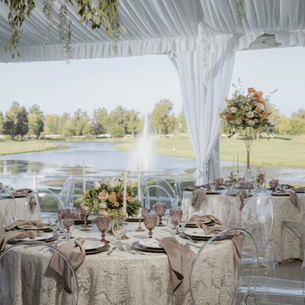 Elegant wedding reception setup at Lakeside at Bartley Cavanaugh, featuring waterfront views, refined décor, and a scenic golf course backdrop.