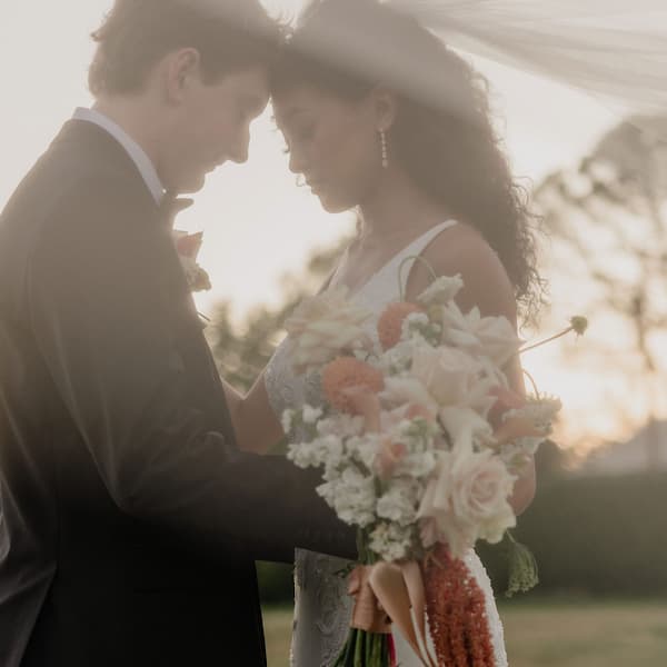 Bride and groom sharing a quiet moment during an outdoor wedding at the Pavilion at Haggin Oaks.